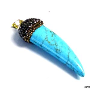 Pendentif défense d&rsquo;éléphant turquoise bleue