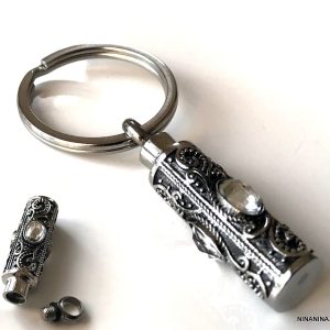 Porte clé Bijou pendentif parfum vide acier inoxydable