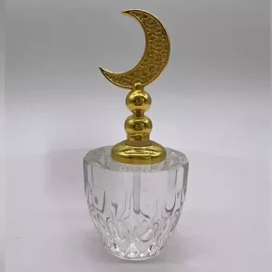Flacon de parfum vide en verre avec bouchon doré en forme de croissant de lune